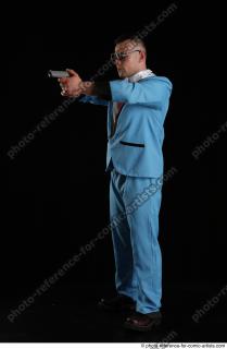 02 2018 01 MICHAL AGENT STANDING POSE WITH GUN